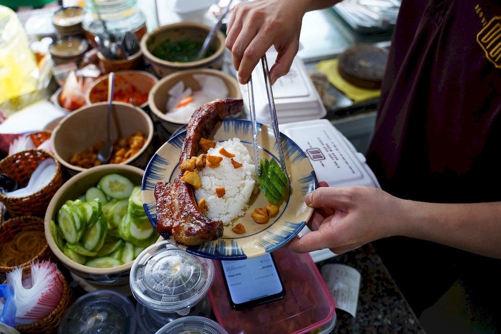 The 300g+ five-spice pork chop with charred edges is a mouthwatering favorite among loyal diners